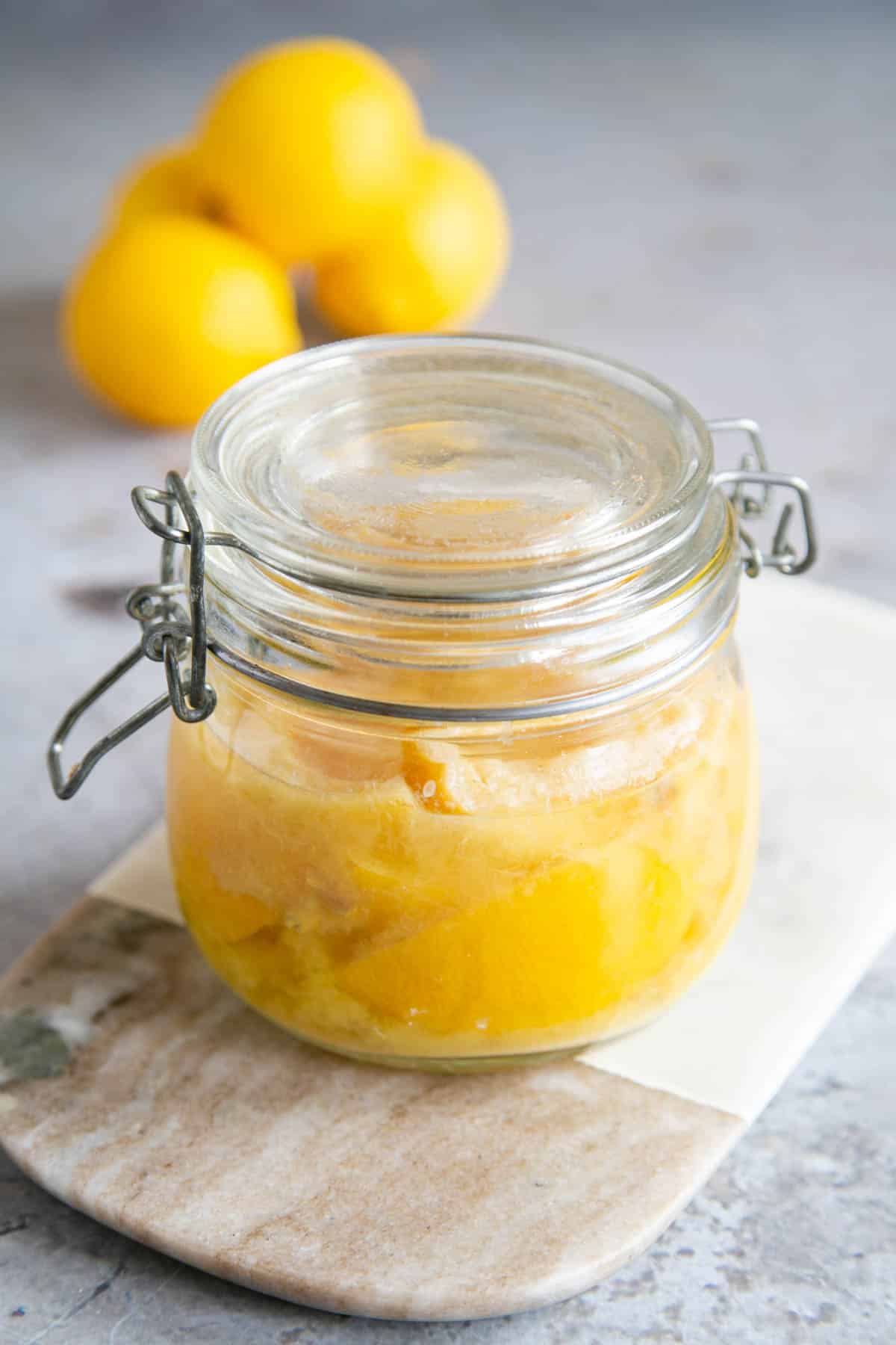 The lemons packed tight in a jar, which must be shaken from time to time as the lemons mature.