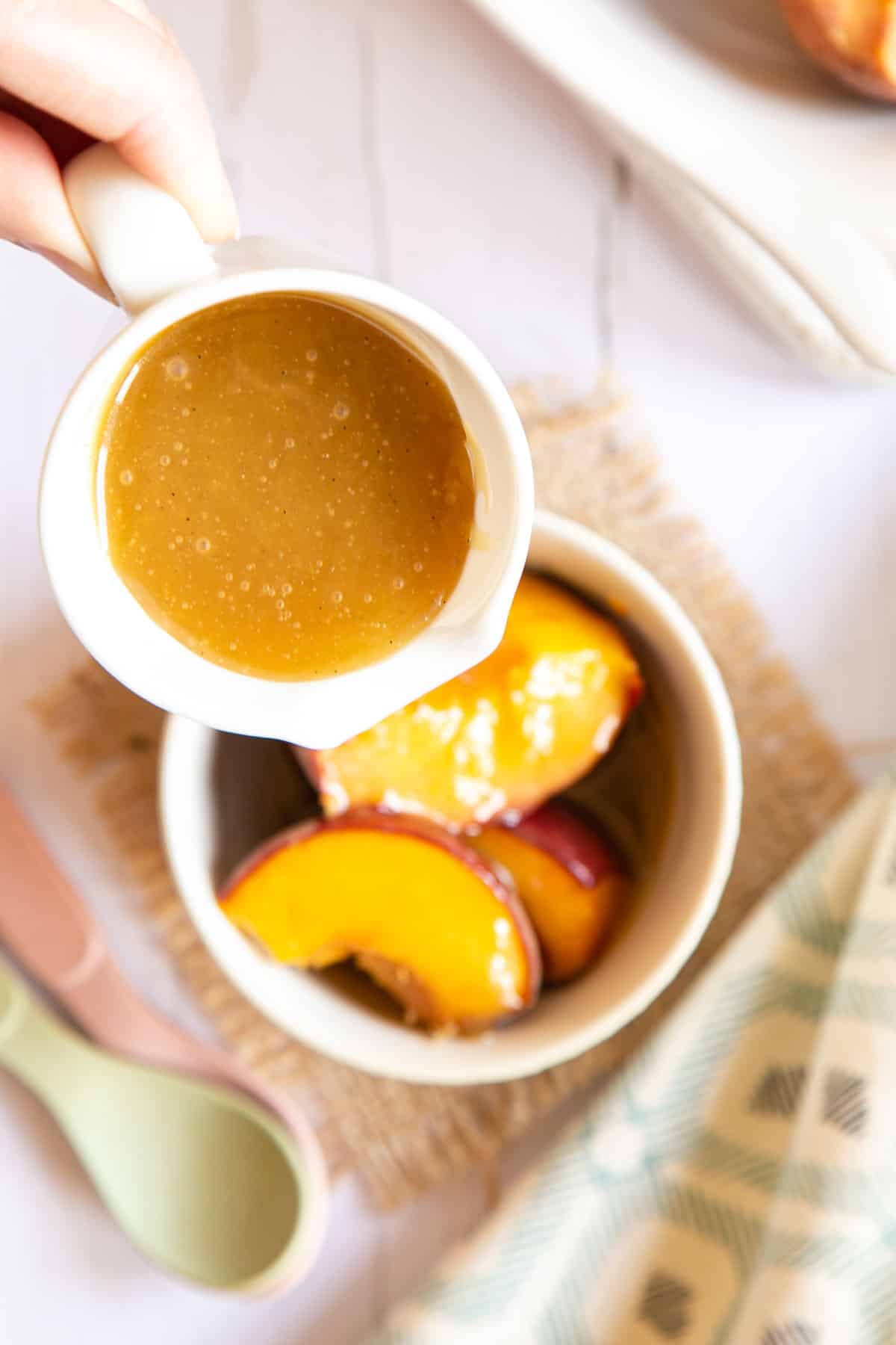 Adding more sauce to the peaches - delicious!