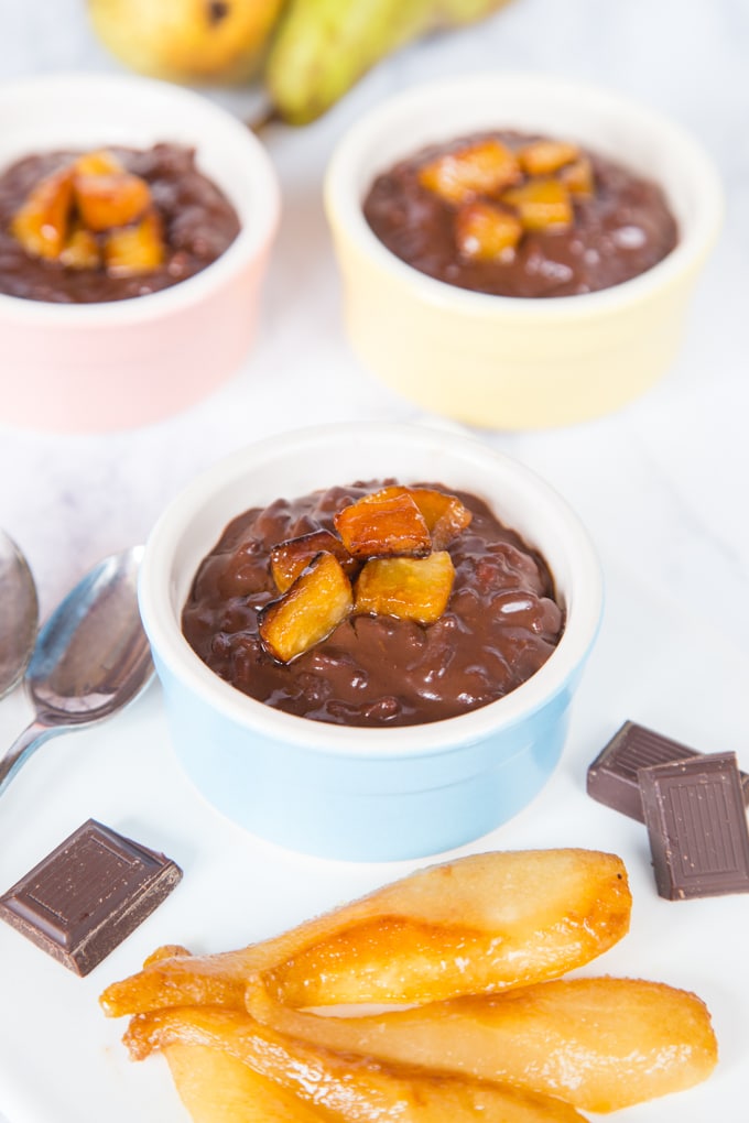 small pudding dishes of a rich dark chocolate risoto served with caramelized pears
