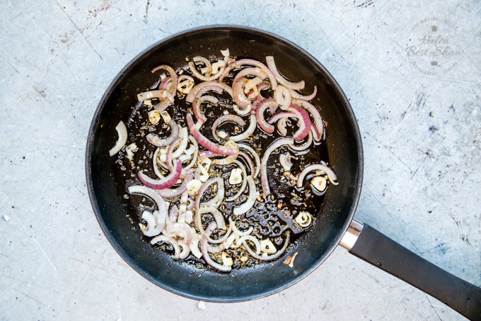 Greek salad pasta – step one – a pan of red onions and garlic fried until they are soft. 
