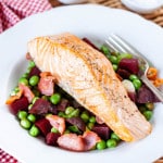 Salmon with peas, beetroot and bacon