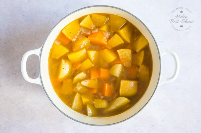 A pot of cooked spiced pumpkin soup- ready for blending