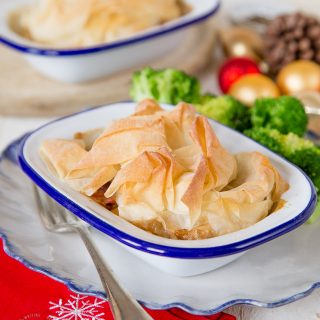 An easy recipe to use up leftover Christmas or Thanksgiving Turkey. Topped with a single sheet of foil pastry for texture these pies are lighter than a traditional pastry covered pie.