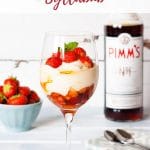 A glass full of pimms and strawberry syllabub