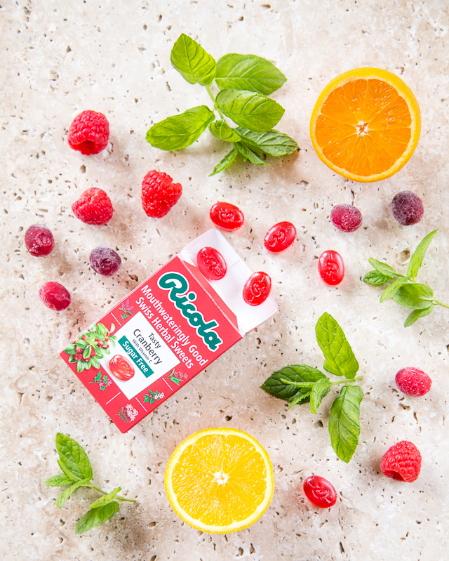 This refreshing cranberry, raspberry and orange mocktail is made with a surprising secret ingredient - Ricola boiled sweets!