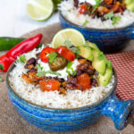 These black bean and tomato burrito bowls have a spicy kick from pickled jalapeños.
