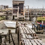 The ramshackle palafitte port of Carrasqueira is build on stilts and is a must visit on any trip to Portugal's Alentejo.
