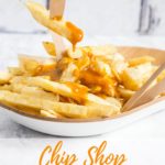 A plate of chip shop fat chips covered with golden brown Chinese curry sauce. A hand holds a chip fork with a single chip on it with the sauce dripping off. Text overlay reads Chip Shop Curry Sauce.