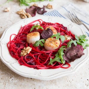 Spaghetti tossed in cooked beetroot. Served with scallops and walnuts