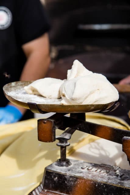 Fresh dough on weighing scales at the market Ventalló Catalonia