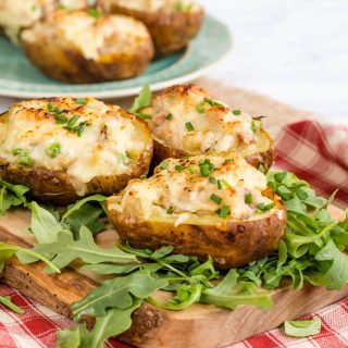 Delicious twice baked potatoes stuffed with cheese, ham and turkey. A perfect post Christmas meal.