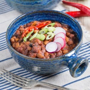 Delicious vegan 5 bean chilli served in blue pottery bowls