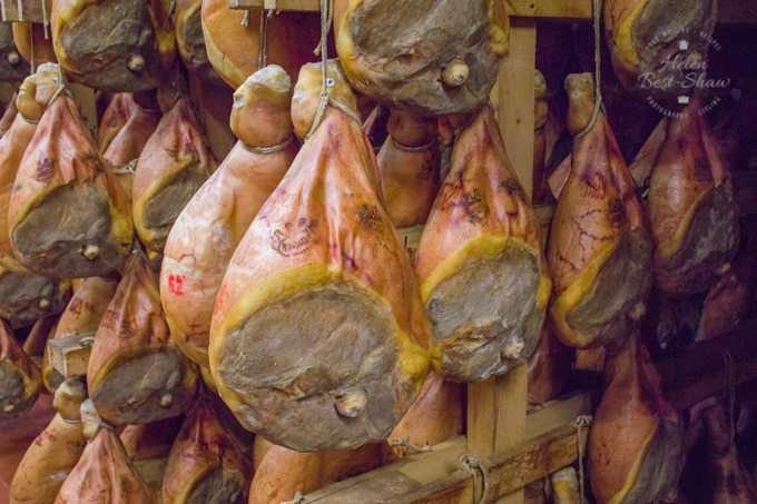 Racks of Parma hams maturing at the producers