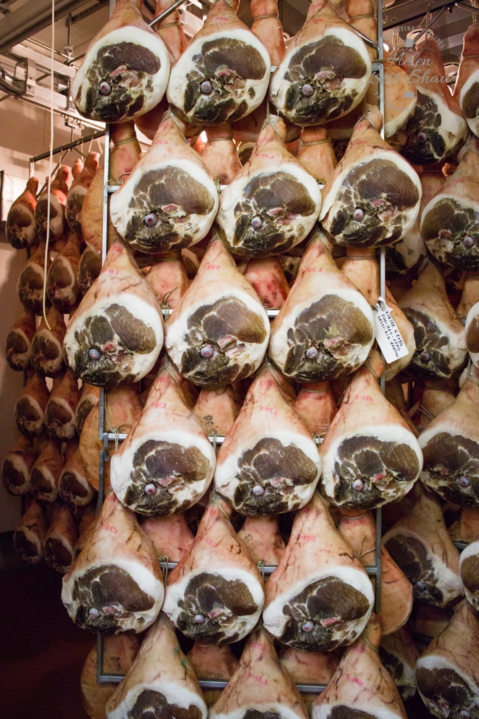 ost legs maturing in cold storage before they become Parma hams 