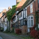 Mermaid Street, Rye, East Sussex. The street is cobbled, and higgledy-piggledy houses look straight onto the street.