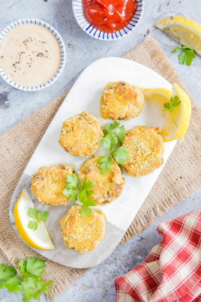 Top down picture of smoked mackerel fish cakes on a marble board.