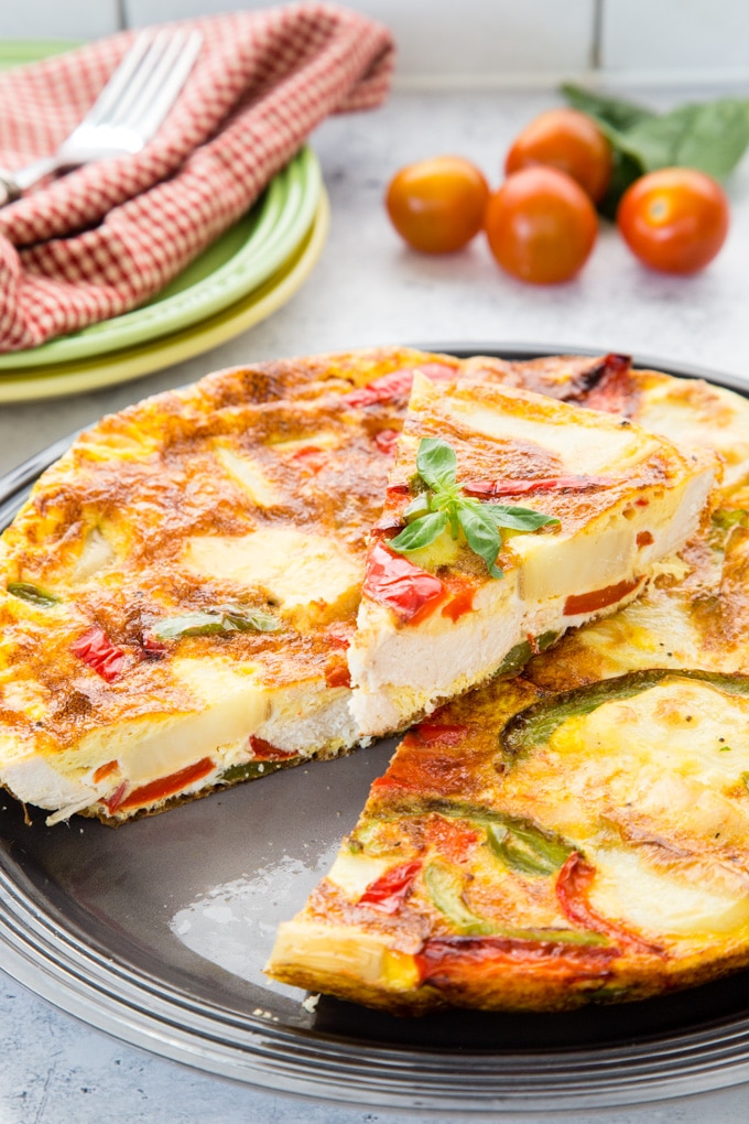 A close up of a turkey frittata made with leftover roast turkey, bell peppers and potatoes.
