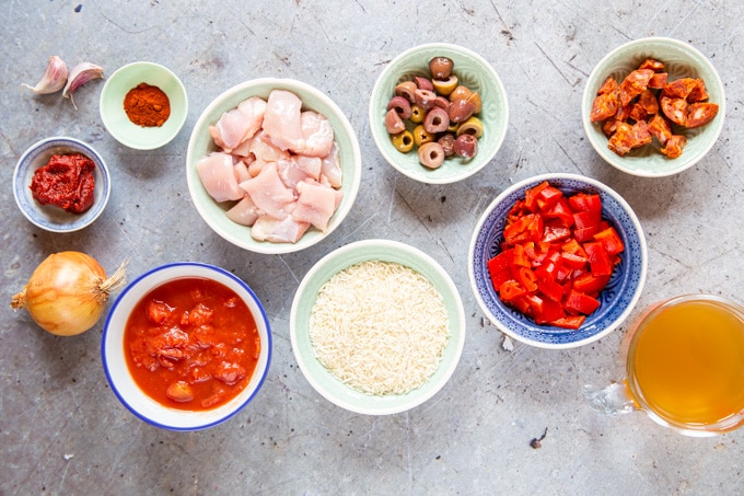 The ingredients for my easy one-pot Spanish chicken with rice, chorizo, olives, peppers and tomato
