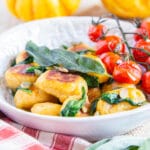 Close up of pumpkin gnocchi in a bowl.