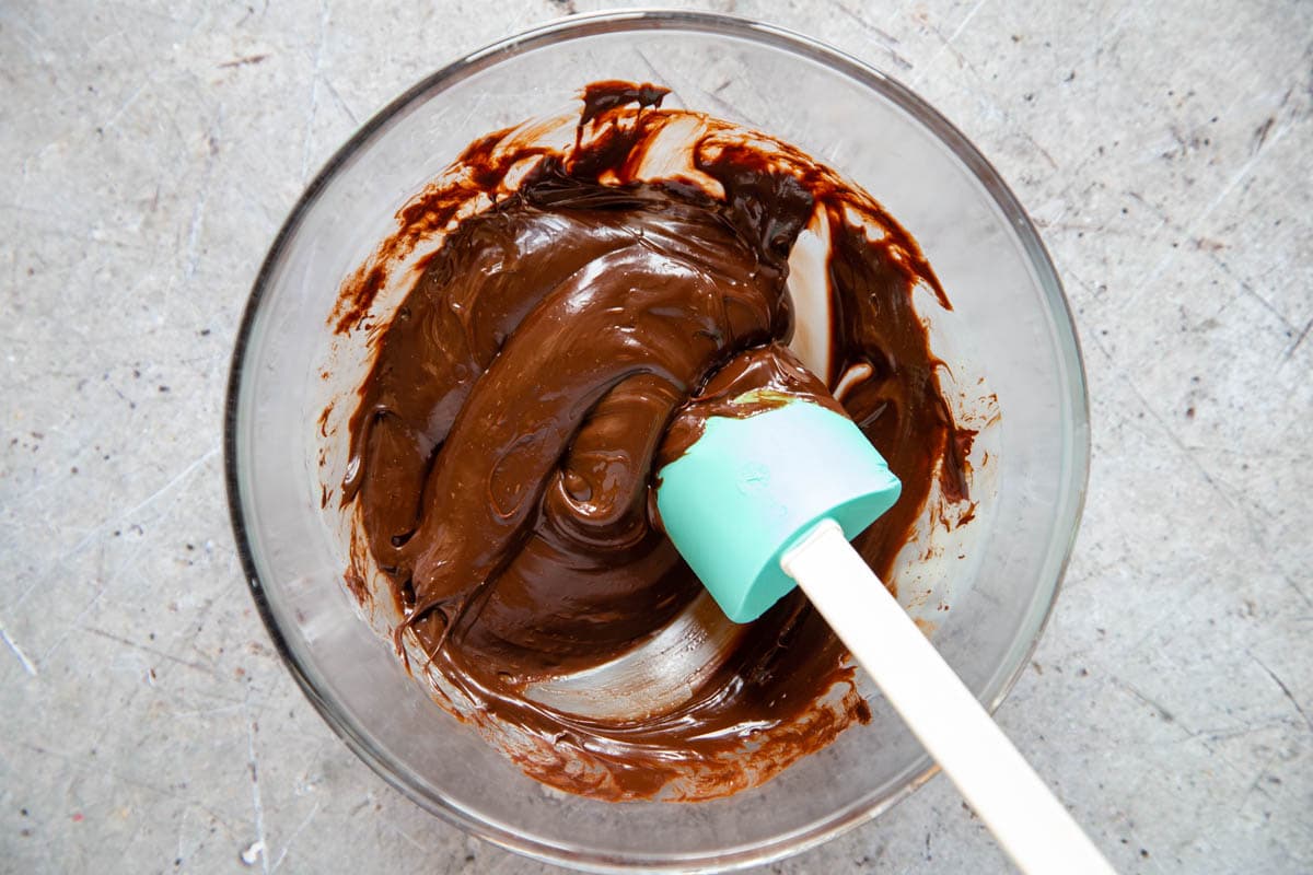 Mixing together the chocolate, mints and condensed milk into a smooth