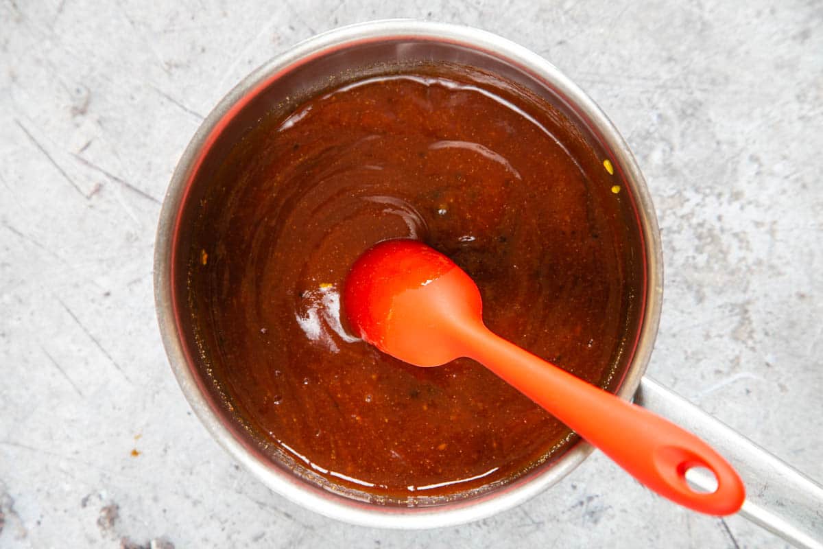 Rick barbecue sauce ingredients in a saucepan, ready to be gently reduced.