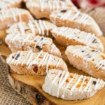 A close up of biscotti glazed with drizzles of icing, ready to serve.