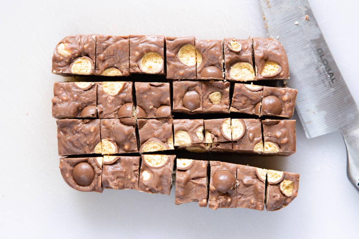 Maltese fudge chopped into 1cm cubes. A sharp knife has been used so that the maltesers are cut cleanly.