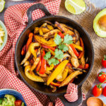 Vibrant yellows and red from the peppers really make this leftover turkey fajita mix look delicious. It's been garnished with some coriander for a splash of green.