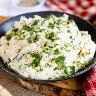 A delicious bowl of smooth, soft celeriac mash, topped with parsley