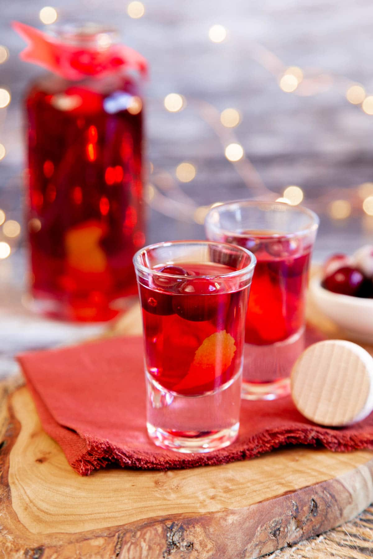 Cranberry vodka looks as good as it tastes, glowing a warming winter red against festive fairy lights.