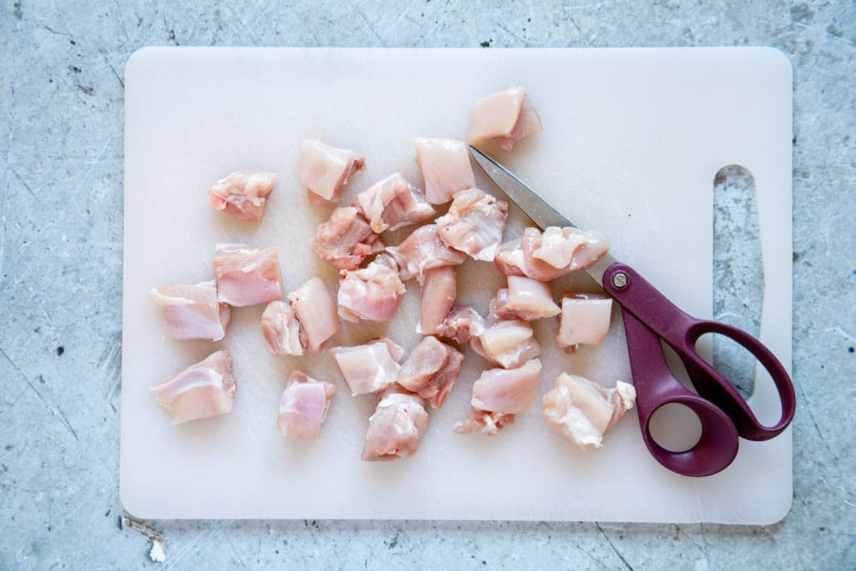 Trimming and cutting the chicken is easy with a pair of sharp kitchen scissors.