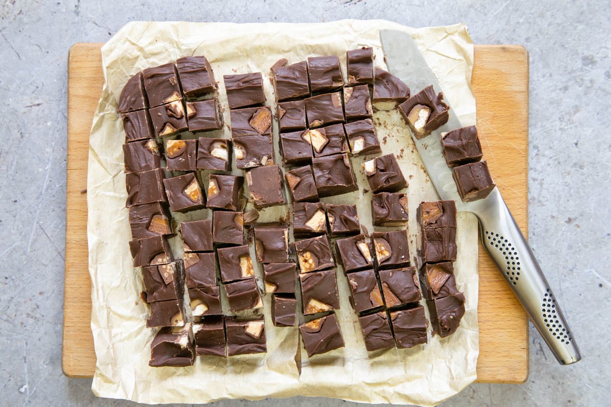Once set, the fudge can be removed from the tray and cut into squares.