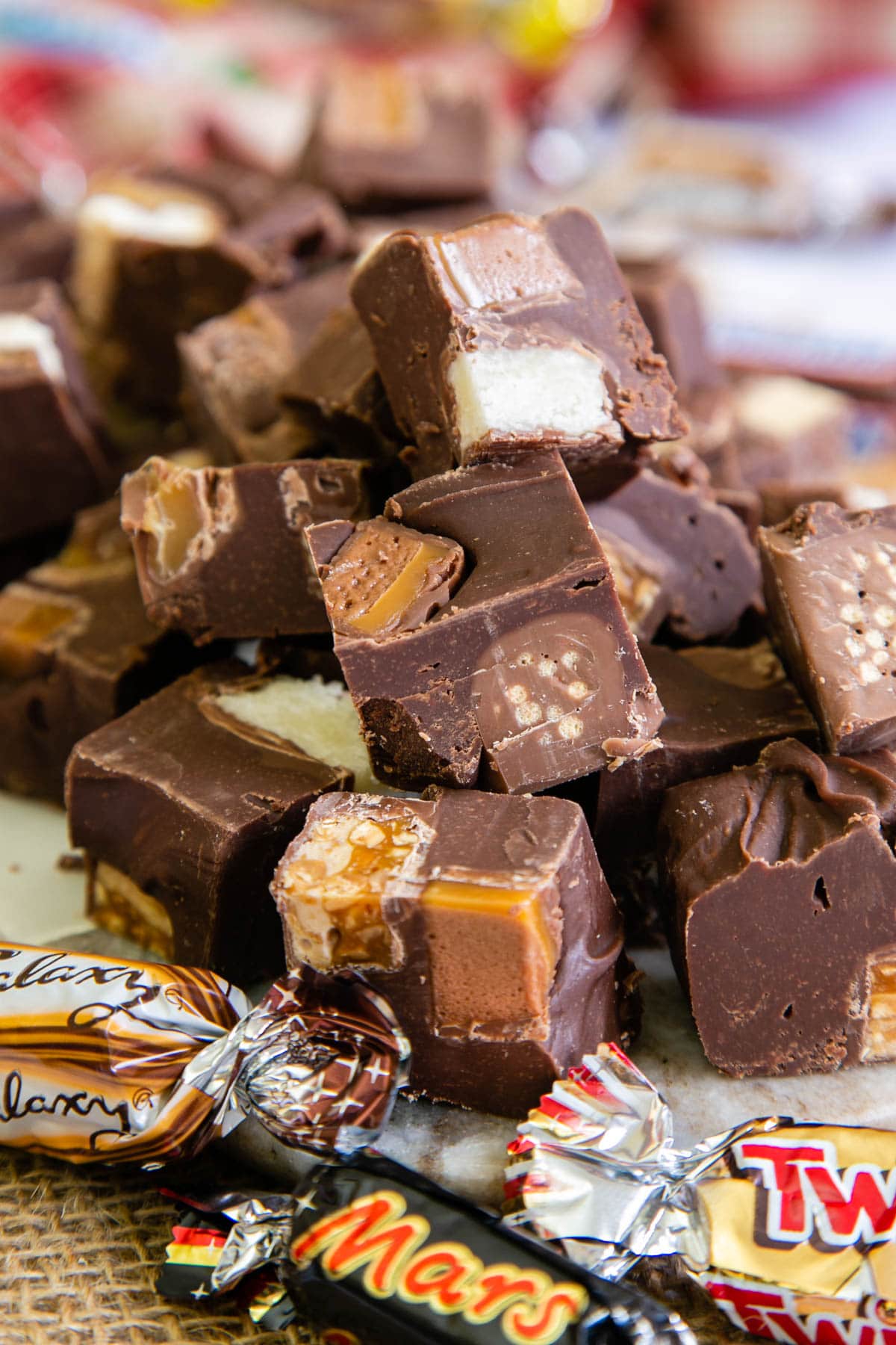 Leftover chocolates fudge cut into cubes, showing the fillings of the different chocolates inside.