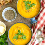 Delicious golden carrot and parsnip soup, garnished and ready to serve.