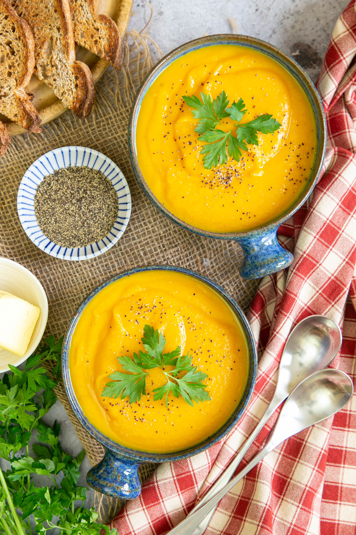 Delicious golden carrot and parsnip soup, garnished and ready to serve.