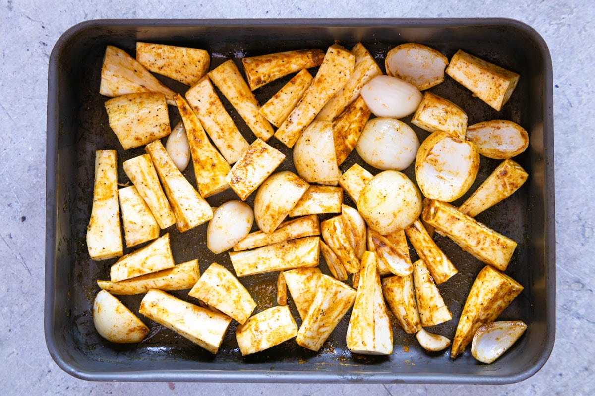 The vegetables are spread out in one layer for roasting.