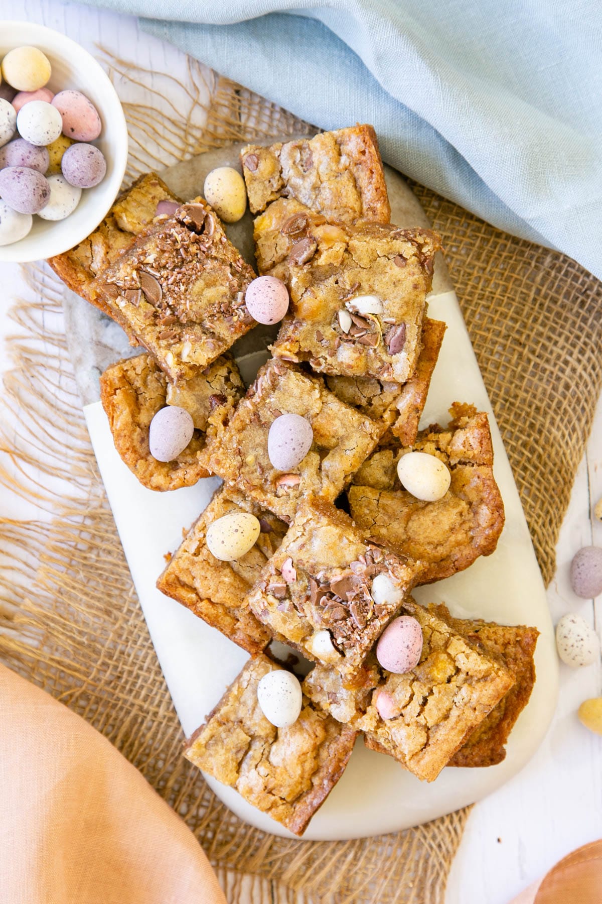 These mini egg blondies look gorgeous, served with a scattering of extra eggs.