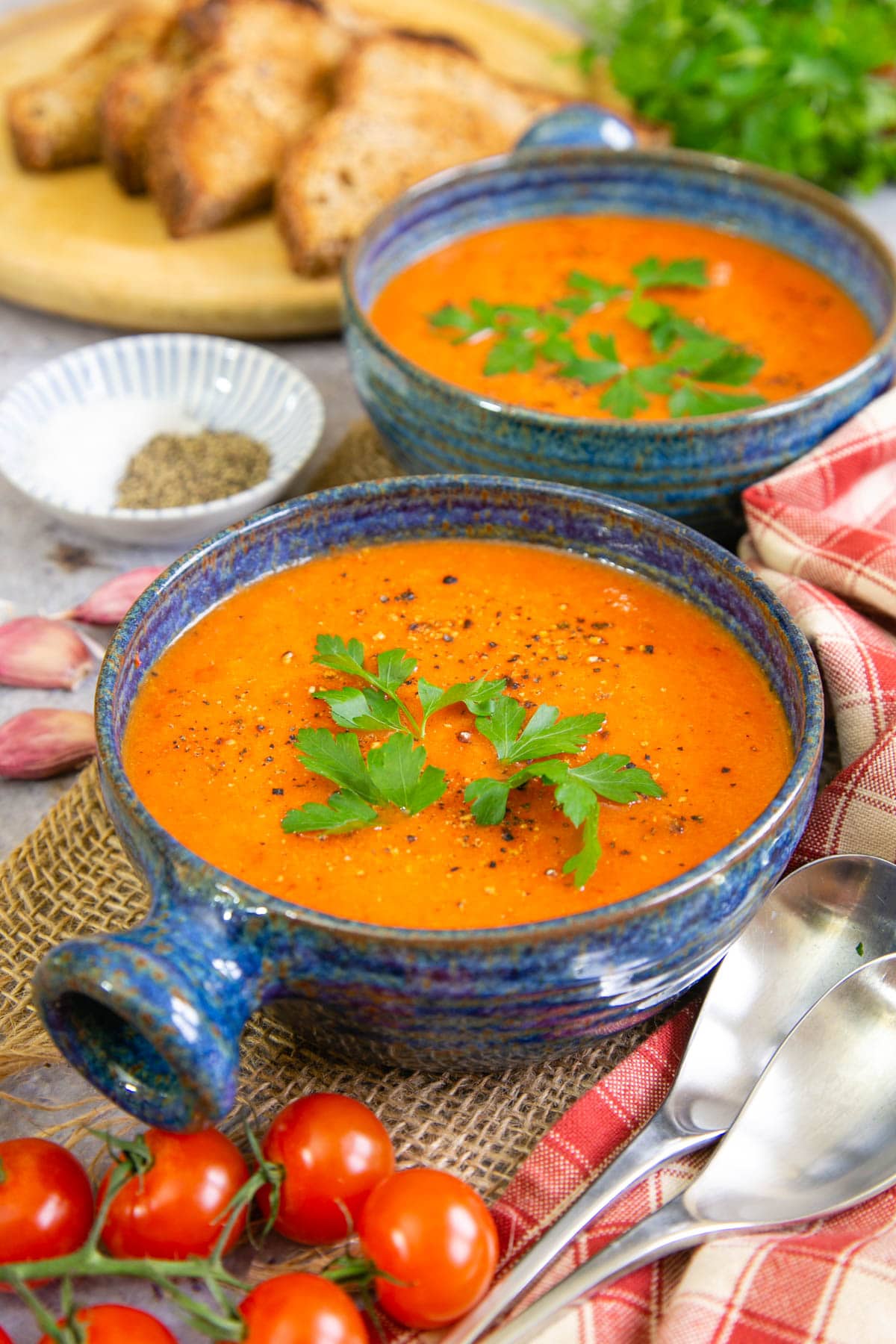 Rich, sweet, piquant tomato and red pepper soup exudes warmth with a rich orange red colour.