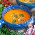 Garnished with seeds and fresh herbs, this vibrant tomato soup brings a little sunshine to your lunch break.