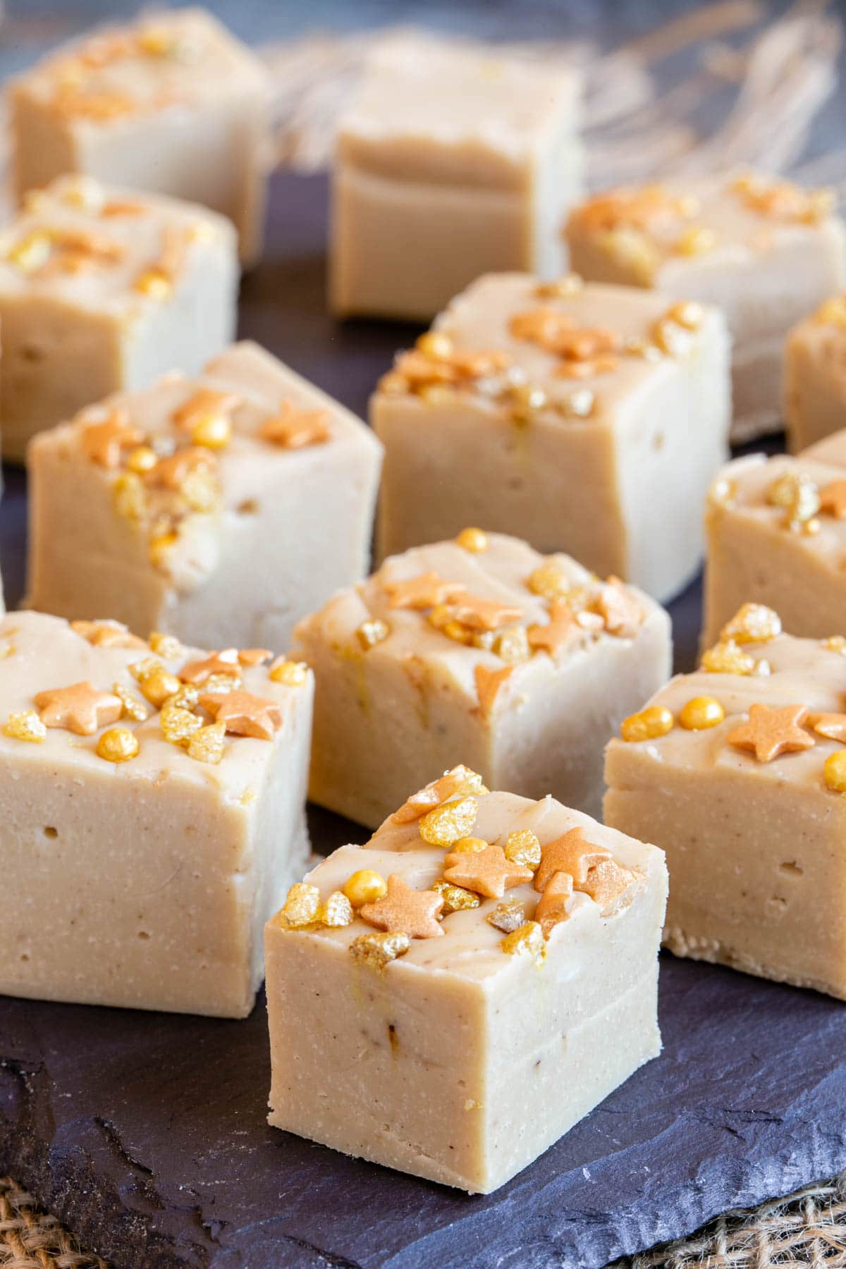 Pale, creamy and delicious, these gorgeous little cubes of coffee fudge look irresistable with a topping of golden cake sprinkles.
