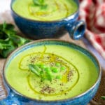 Two bowls of pea and mint soup