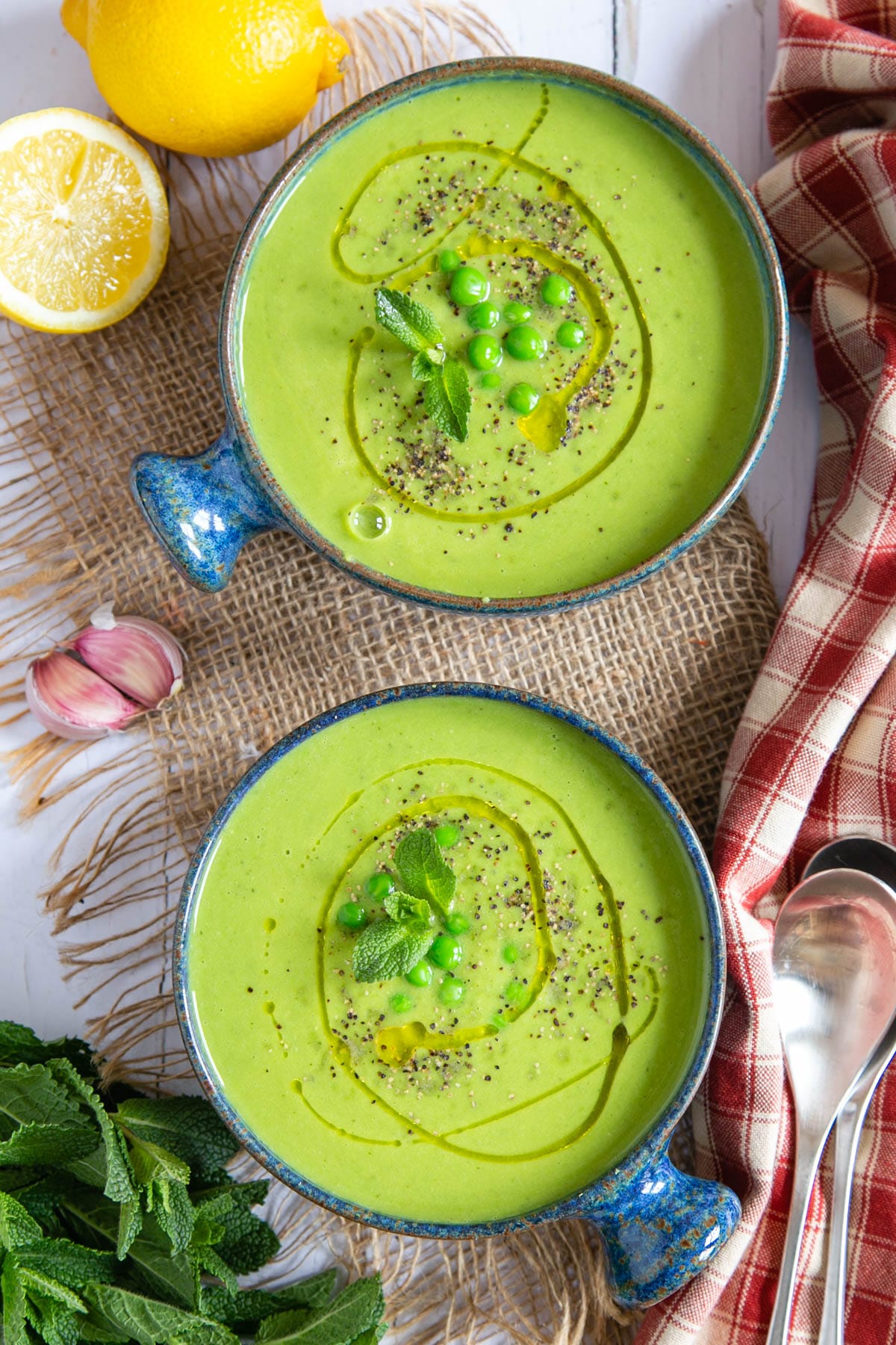 This zesty green pea and mint soup looking inviting served in contrasting bowls.