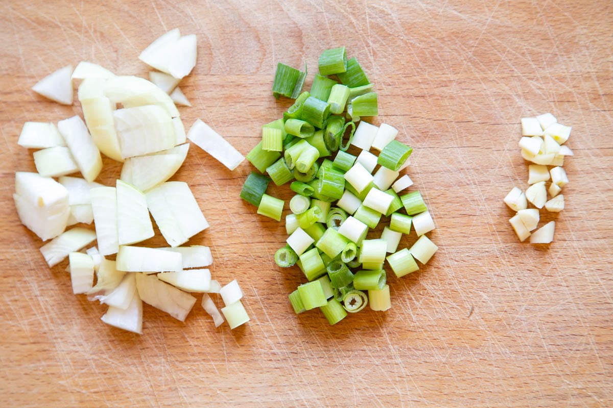 The onion, spring onion and garlic, chopped and ready to cook.
