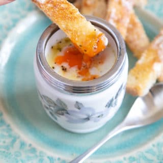 Dipping a finger of toast into the succulent golden yoke of a coddled egg, prettily presented in a traditional coddler.