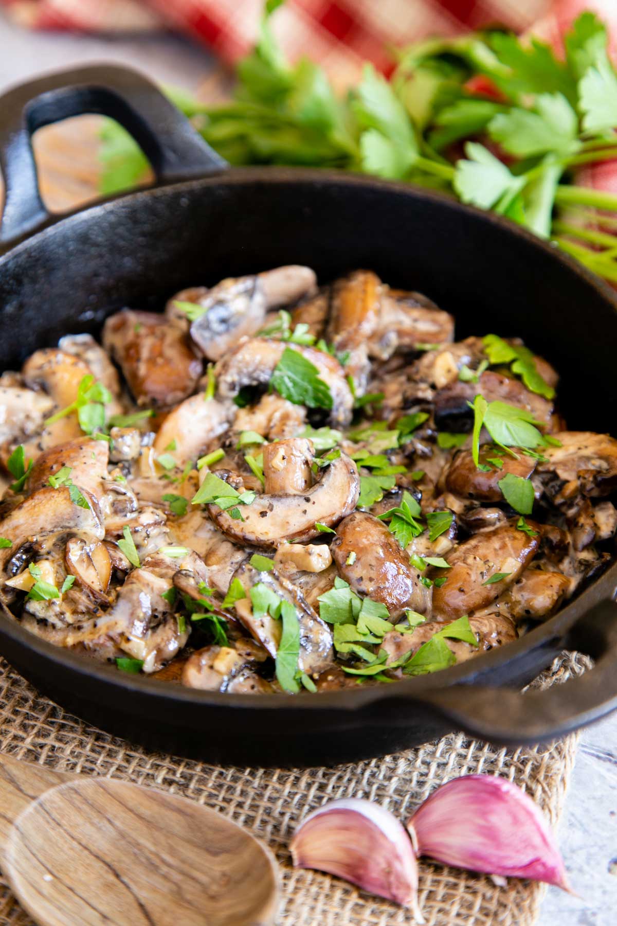 Gorgeous garlic mushrooms with cream, served in a heavy serving dish for a rustic look.