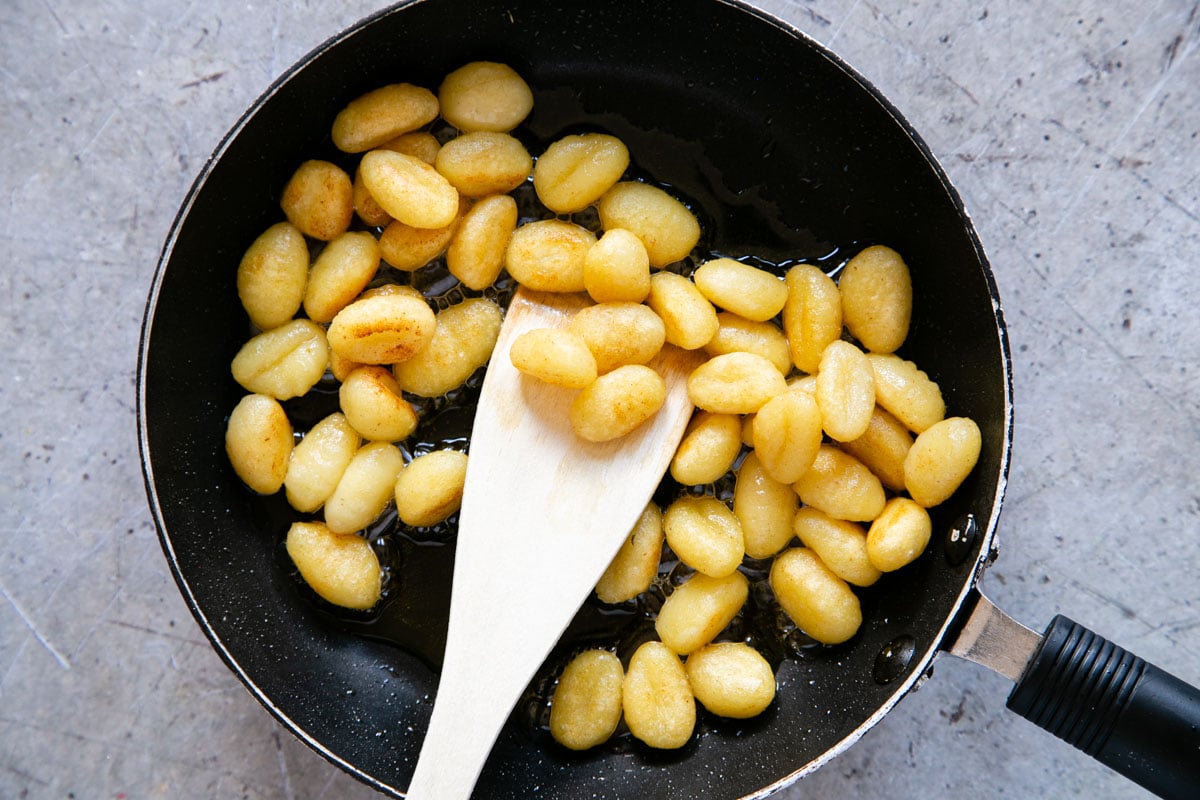 The gnocchi are ready when golden and crispy and reduced in size.