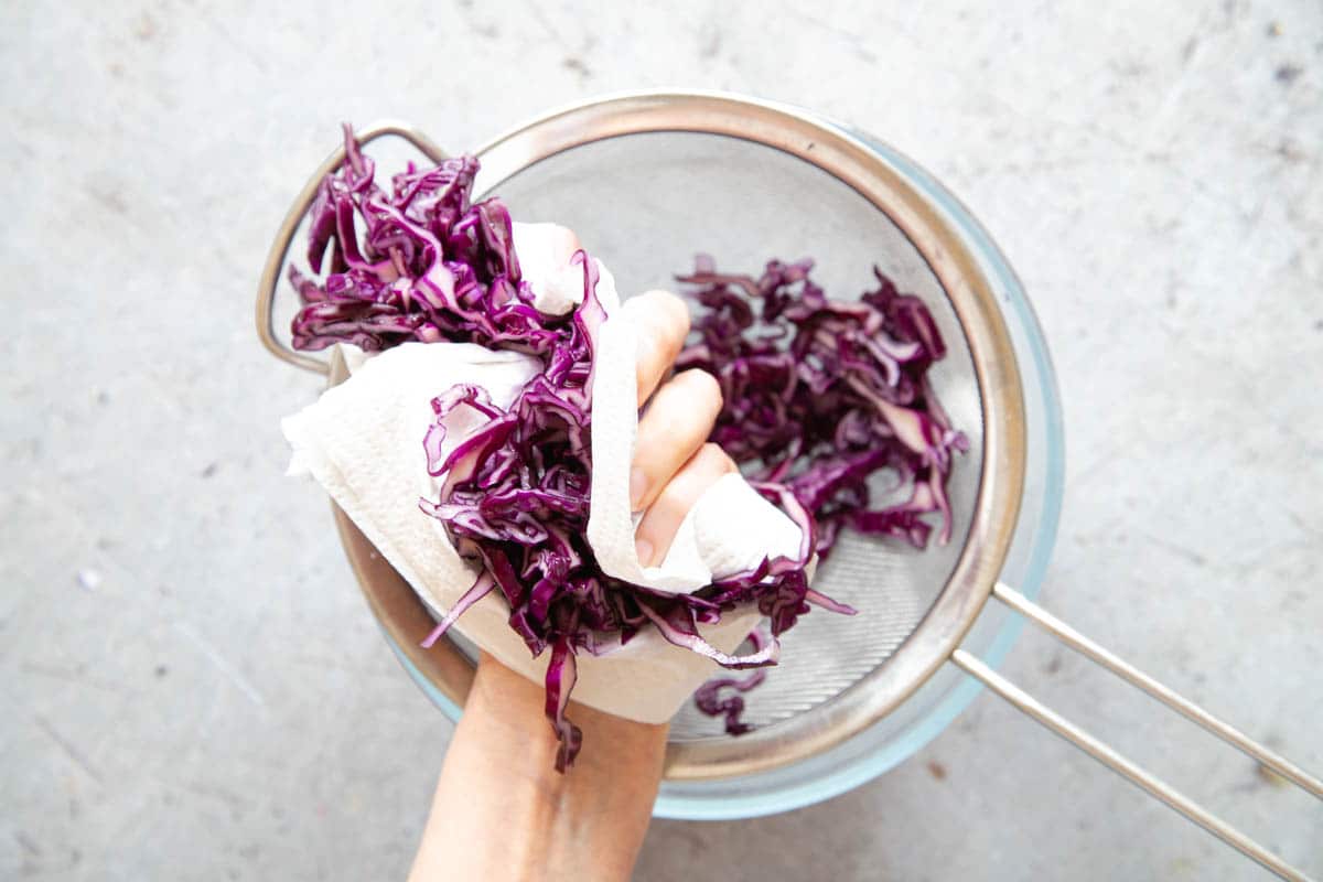 Squeeze out any excess liquid from the cabbage.