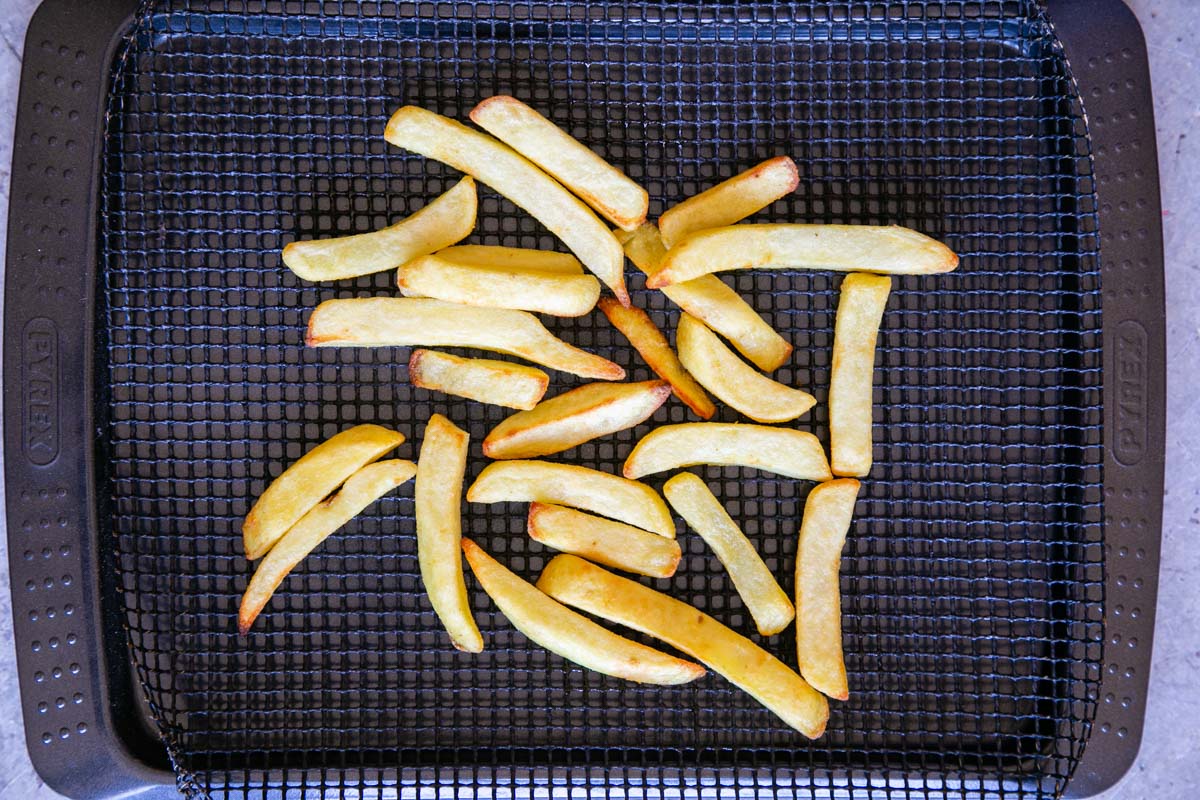 Cook the oven chips according to the instructions on the pack.