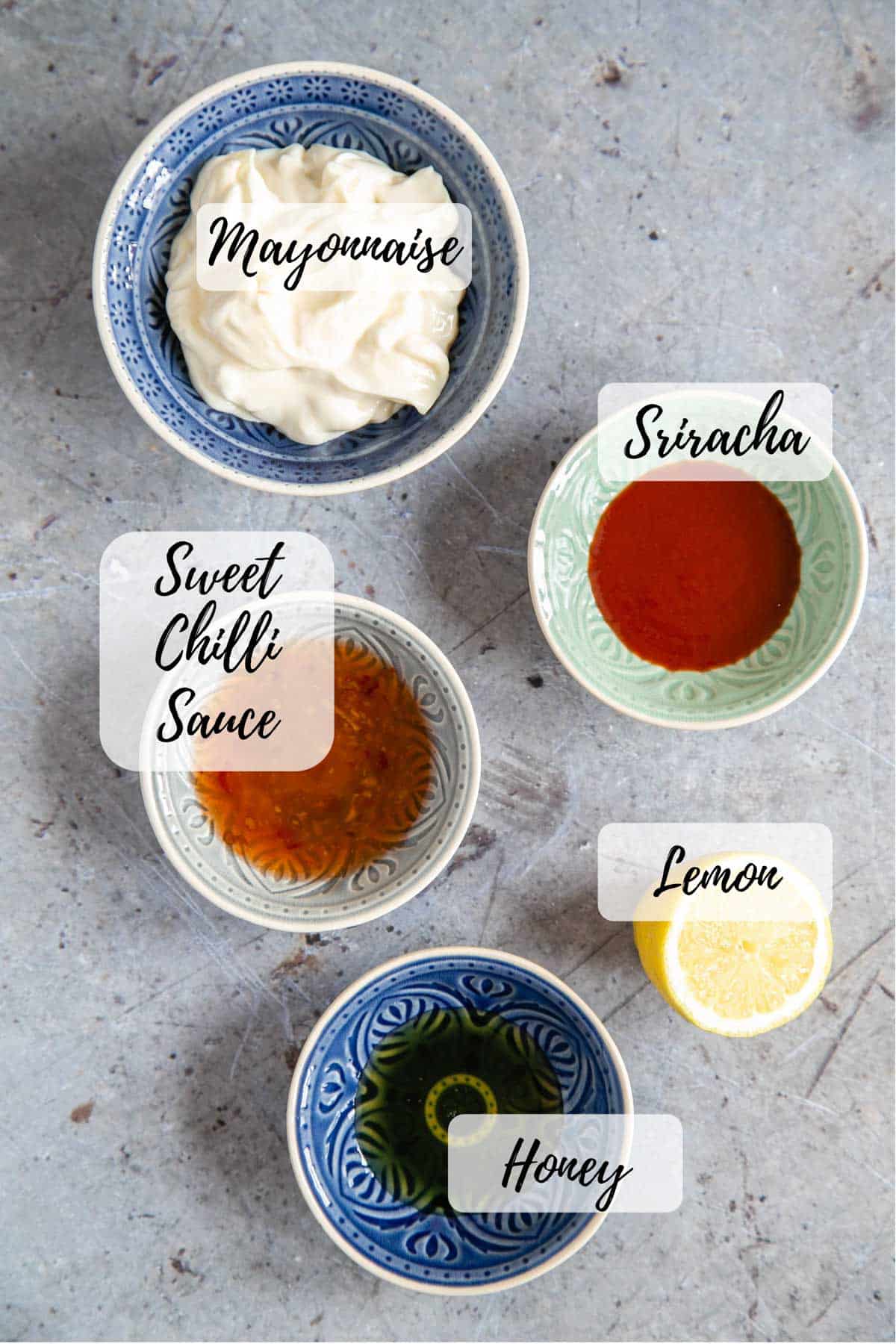 Ingredients for bang bang sauce: mayonnaise, sriracha sauce, lemon, honey, sweet chilli sauce