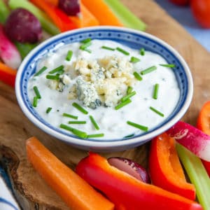 Blue cheese dip, dressed up for a party with a garnish of blue cheese and snipped chives.